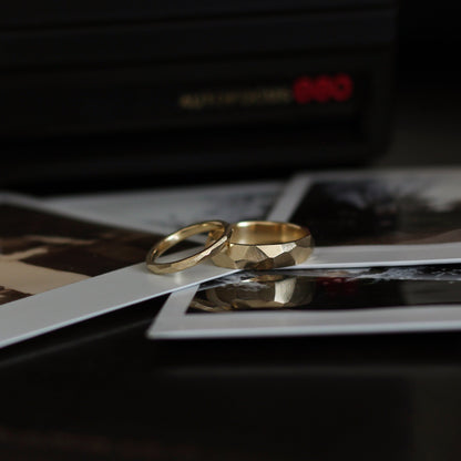 Geometric Faceted Ring - 9ct/18ct Gold, 2mm and 5mm width on a stack of polaroid photos - Aisling Chou Studio